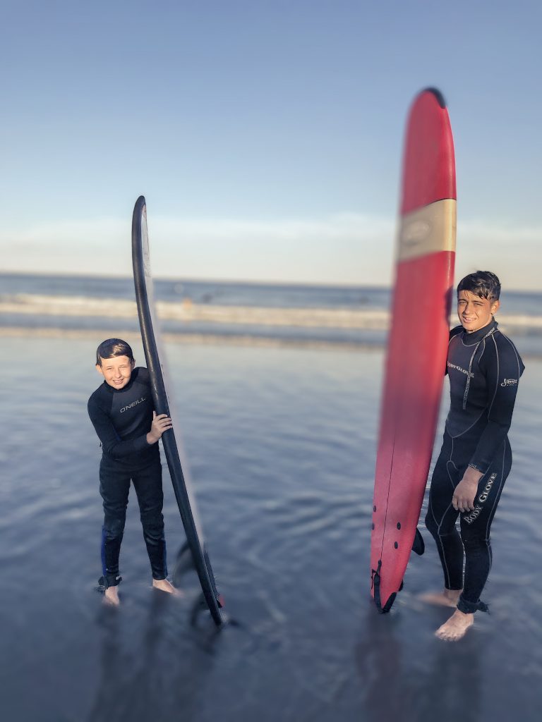 Jack surfing with his brother
